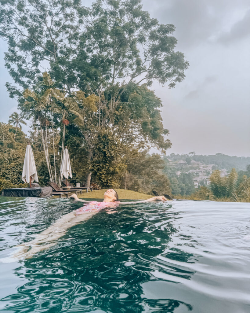 Woman takes in the serenity of Alila Ubud in Bali - made even sweeter by the fact the hotel was free thanks to credit card rewards. Photo by Kevin Schadt