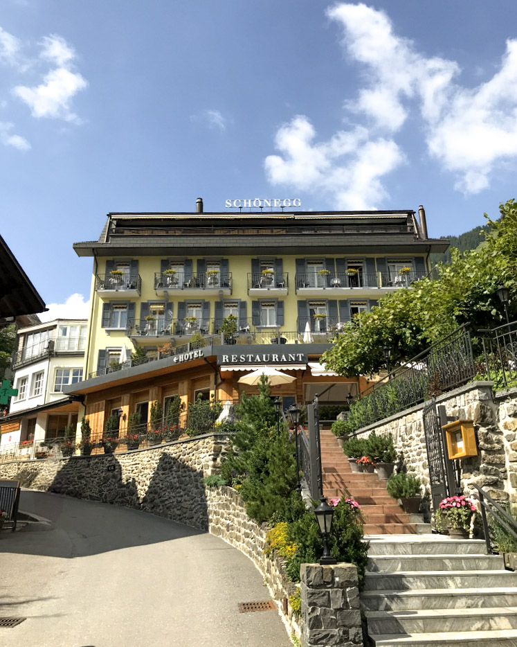 At the top of a hill perches the Hotel Schonegg in Wengen, Switzerland.