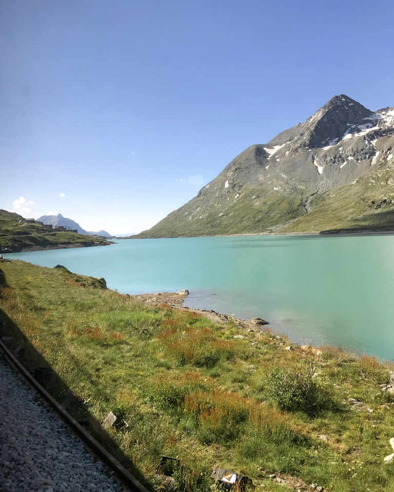 Teal blue lake water in the Swiss Alps.