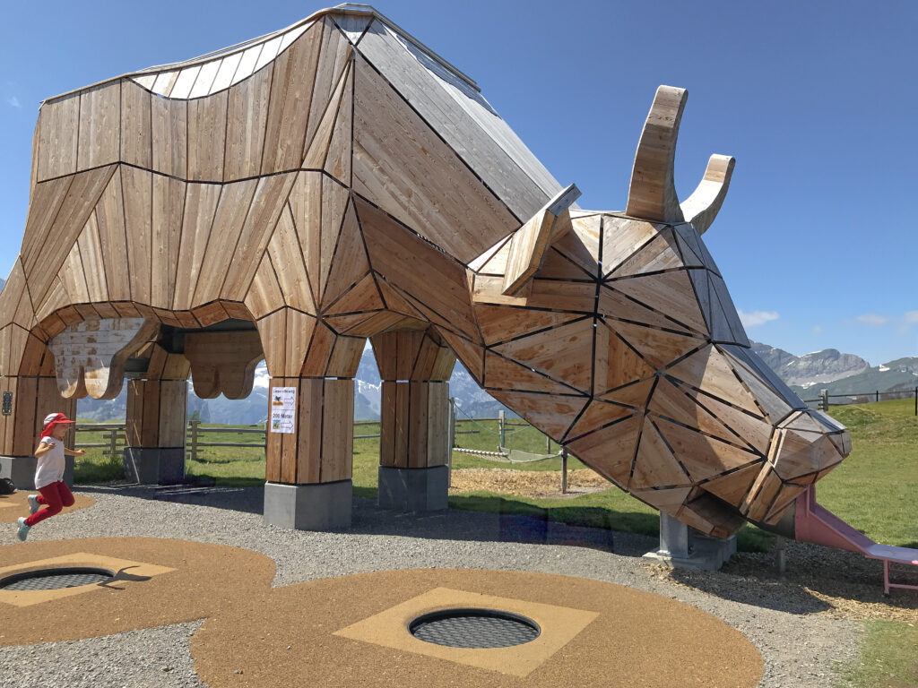 Alpine Herdsman's Playground, Switzerland. A slide that's shaped like a cow and a park on top of the world. 