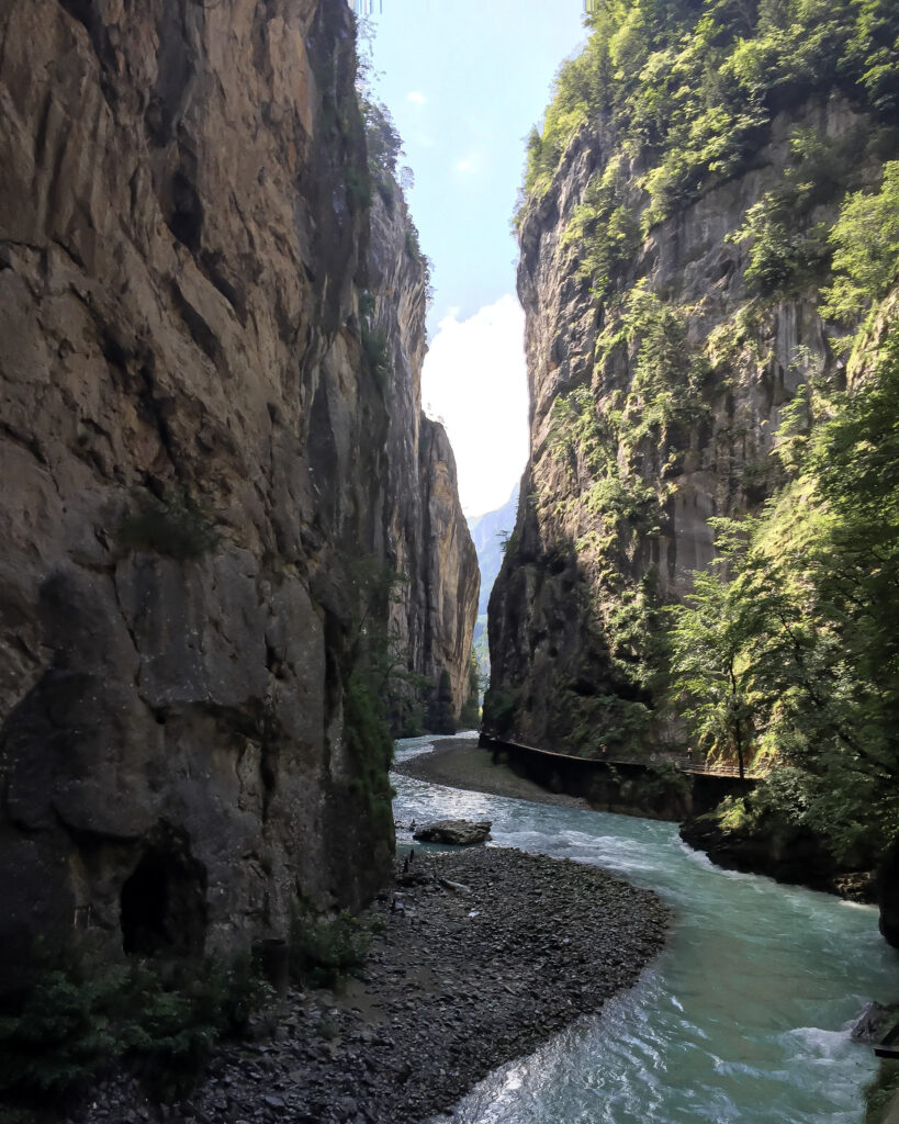 Nestled between two mountains flows a teal blue river with an elevated walkway you can take that weaves through the mountain. This is the Aare Gorge in Switzerland - simply beautiful. Photo by Amy Berrian.