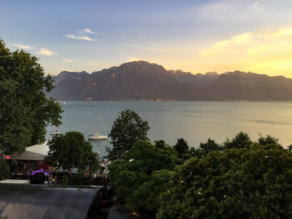 The sun sets over Lake Geneva as we enjoy the Montreaux Jazz Festival from our balcony at The Royal Plaza Montreaux.