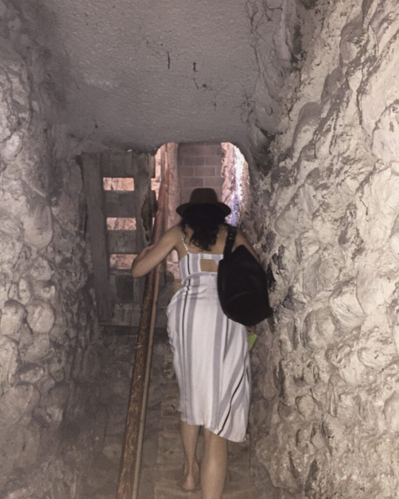 Climbing up a narrow stone staircase in Chillon Castle.