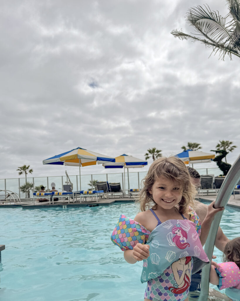 Young girl enjoys the pool at The Seabird Resort.