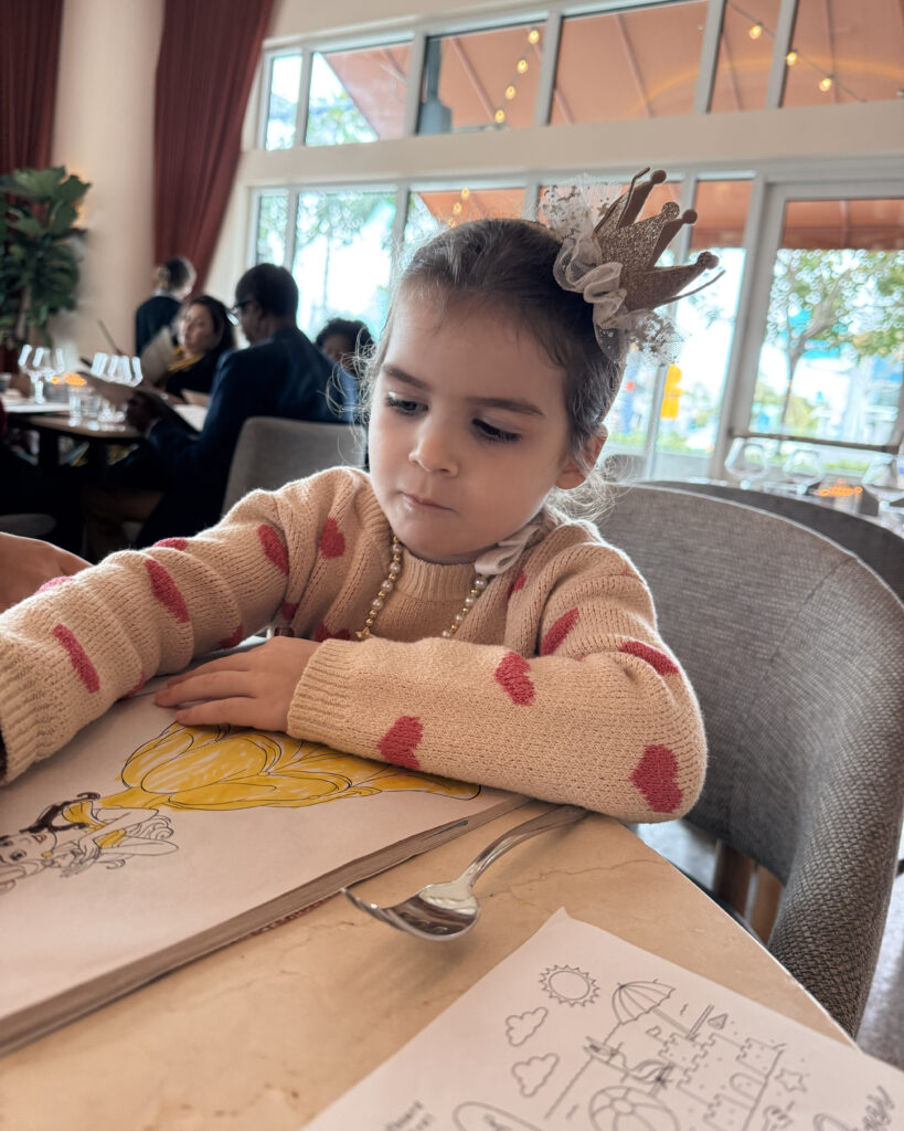 Little girl colors at Piper Restaurant.